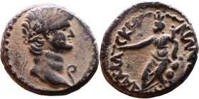 Nero (54-68) Damascus, Syria. Bronze coin. Obv:Laureate, draped bust of emperor. Rev: Tyche seated left on rock with arm outstretched, holding cornuco...