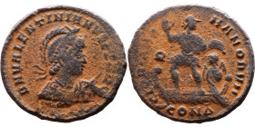 Valentinian II (375-392) Follis. Obverse: D N VALENTINIA NVS IVN P F AVG pearl-diademed, helmeted, draped, cuirassed bust right. holding spear and shi...