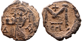 Constans II (641-668) Follis. Obverse: Imperial figure holding cross and globus Reverse: m and inscription

22mm 4,57g

Artificial sand patina
