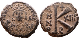 Maurice Tiberius (582-602) Half Follis Obverse: Crowned bust facing, wearing consular robes, holding mappa and eagle-tipped scepter , Reverse: Large K...