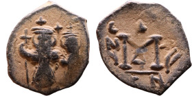Constans II (641-668) Follis. Obverse: Imperial figure holding cross and globus Reverse: m and inscription

19mm 2,92g

Artificial sand patina