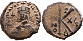 Maurice Tiberius (582-602) Half Follis Obverse: Crowned bust facing, wearing consular robes, holding mappa and eagle-tipped scepter , Reverse: Large K...