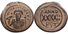 Phocas (602-610) Follis. Obverse: DN FOCA PERP AVG Crowned bust facing, wearing consular robes, holding mappa and eagle-tipped scepter , Reverse: Larg...
