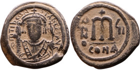 Tiberius II Constantine (578-582). Follis. Obverse: mperor, crowned and mantled bust facing, holding mappa and eagle-tipped sceptre, cross above eagle...