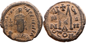 Maurice Tiberius (582-602) Follis. Obverse: Helmeted and cuirassed bust facing, holding globus cruciger and shield., Reverse: Large M above cross, ANN...