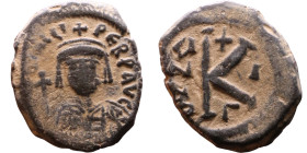 Maurice Tiberius (582-602) Half Follis. Obverse: Helmeted and cuirassed bust facing, holding globus cruciger and shield., Reverse: Large K above cross...