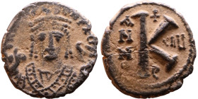 Maurice Tiberius (582-602) Half Follis Obverse: Crowned bust facing, wearing consular robes, holding mappa and eagle-tipped scepter , Reverse: Large K...