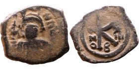 Maurice Tiberius (582-602) Half Follis. Obverse: Helmeted and cuirassed bust facing, holding globus cruciger and shield., Reverse: Large K above cross...