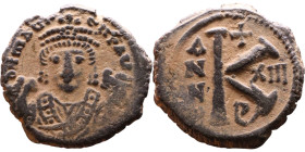 Maurice Tiberius (582-602) Half Follis Obverse: Crowned bust facing, wearing consular robes, holding mappa and eagle-tipped scepter , Reverse: Large K...