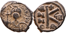 Maurice Tiberius (582-602) Half Follis. Obverse: Helmeted and cuirassed bust facing, holding globus cruciger and shield., Reverse: Large K above cross...