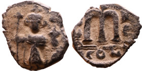 Constans II (641-668) Follis. Obverse: Imperial figure holding cross and globus Reverse: m and inscription

17mm 2,56g

Artificial sand patina