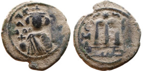 al-Malik ibn Marwan (687-705), Byzantine style folis Obverse: Imperial figure holding globe and cross Reverse: M and inscription

21mm 4,10g