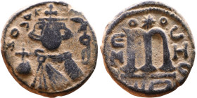 al-Malik ibn Marwan (687-705), Byzantine style folis Obverse: Imperial figure holding globe and cross Reverse: M and inscription

17mm 3,61g