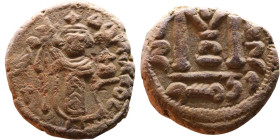 al-Malik ibn Marwan (687-705), Byzantine style folis Obverse: Imperial figure holding globe and cross Reverse: M and inscription

16mm 4,22g