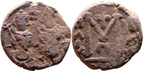 al-Malik ibn Marwan (687-705), Byzantine style folis Obverse: Two standing figures Reverse: Large M and inscription

18mm 4,26g