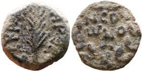 JUDAEA. Jerusalem mint. Porcius Festus (time of Nero, 59-62 AD). Bronze Prutah. Obv.: Palm-branch surrounded by L C•KAIC-APOC. Rev.: NEP • ωNO • C in ...