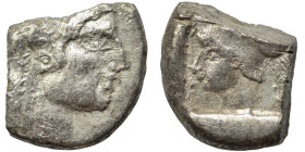 Greek. Ar (silver, 6.39 g, 20 mm). Head of Apollo (?) right. Rev. Helmeted head of Athena left. Nearly very fine.