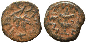 JUDAEA. First Jewish War, 66-70 AD. Prutah (bronze, 2.18 g, 15 mm), 68-69 / year 3. Amphora. Rev. Vine leaf on branch with tendril. Hendin 6392. Nearl...