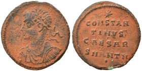 Constantine II, as Caesar, 316-337. Follis (bronze, 1.60 g, 17 mm), Antioch. Laureate, draped and cuirassed bust of Constantine II facing with his hea...