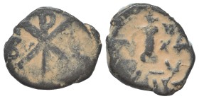 Justinian I, 527-565. Decanummium (bronze, 1.42 g, 14 mm), unusual hybrid, uncertain mint. Chi-Rho. Rev. Large I surmounted by cross, regnal year to r...