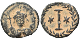Justinian I, 527-565. Decanummium (bronze, 4.69 g, 18 mm), Rome. D N IVSTINIANVS AVC Helmeted and cuirassed bust facing, holding globus cruciger and s...