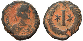 Justinian I, 527-565. Decanummium (bronze, 4.74 g, 18 mm). Rome. Diademed, draped and cuirassed bust right. Rev. Large I between two stars; all within...