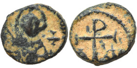 Justinian I, 527-565. Nummus (bronze, 0.69 g, 8 mm), Carthage. Helmeted and draped bust facing, star to left. Rev. Christogram with A and ω flanking (...