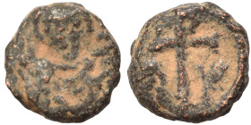 Justinian I, 527-565. Nummus (bronze, 0.70 g, 8 mm), Carthage. Helmeted and draped bust facing, star to left. Rev. Christogram with A and ω flanking (...