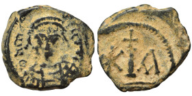 Maurice Tiberius, 582-602. Decanummium (bronze, 2.64 g, 16 mm), Cyzicus. Helmeted and cuirassed bust of Maurice Tiberius facing, holding globus crucig...