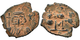 Constans II, with Constantine IV, Heraclius, and Tiberius, 641-668. Follis (bronze, 5.06 g, 23 mm), Constantinople. Helmeted bust of Constans facing, ...