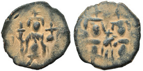 Byzantine (?). Uncertain. Follis (bronze, 2.29 g, 19 mm). Imperial figure standing, facing, holding globus cruciger and long cross. Rev. Two figures s...