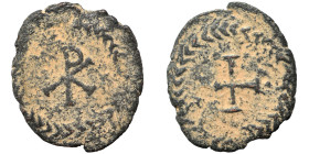 MEROVINGIANS. Childebert I. King of Paris, 511-588; King of Orléans, 524-558. Nummus (bronze, 1.03 g, 15 mm). Christogram within wreath. Rev. Cross pa...