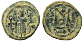 Arab Byzantine. Umayyad Caliphate, circa 685-693 AD. Fals (bronze, 4.18 g, 20 mm), Dimashq (Damascus). Standing imperial figure, holding long cross an...