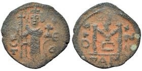 Arab-Byzantine. Fals (bronze, 2.25 g, 19 mm). Dimashq (Damascus). Struck circa 670-680 or later. Standing imperial figure, holding long cross and glob...