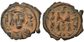 Arab-Byzantine. Umayyad Caliphate. temp. Mu'awiya I ibn Abi Sufyan, AH 41-60 / AD 661-680. Fals (bronze, 2.74 g, 22 mm), Arab-Byzantine, derived from ...