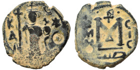 Arab-Byzantine, Umayyad Caliphate. Circa 680s. Fals (bronze, 5.33 g, 21 mm), Hims (Emesa). Standing imperial figure, holding long cruciform scepter an...