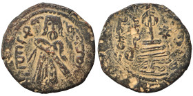 Umayyad Caliphate. Abd al-Malik ibn Marwan, AH 65-86 / 685-705 AD. Fals (bronze, 2.77 g, 20 mm). 'Standing Caliph' type. Caliph standing facing, beard...