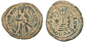 Umayyad Caliphate. Abd al-Malik ibn Marwan, AH 65-86 / 685-705 AD. Fals (bronze, 3.77 g, 22 mm). 'Standing Caliph' type. Caliph standing facing, beard...
