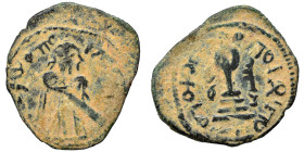 Umayyad Caliphate. Abd al-Malik ibn Marwan, AH 65-86 / 685-705 AD. Fals (bronze, 2.87 g, 32 mm). 'Standing Caliph' type. Caliph standing facing, beard...