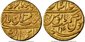 Mughal Empire. Muhammad Shah gold Mohur AH 1144 Year 14 (1731/1732) AU55 NGC, Shahjahanabad mint, KM439.4, Fr-832. Honey toned with an amber sheen and...