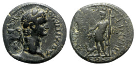 Domitian (81-96). Phrygia, Cibyra. Æ (22.5mm, 6.05g, 6h). Laureate head r.; c/m: eagle standing l., head r., within circular punch. R/ Dionysos standi...