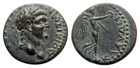 Domitian (Caesar, 69-81). Lycaonia, Iconium. Æ (17mm, 4.74g, 12h). Laureate head r. R/ Nike standing r. [on globe], holding wreath and palm. RPC II 16...