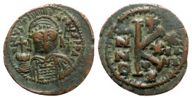Justinian I (527-565). Æ 20 Nummi (27mm, 9.08g, 6h). Cyzicus, year 24 (550/1). Helmeted and cuirassed bust facing, holding globus cruciger and shield;...