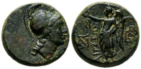 AEOLIS, Aigai. Ae16. (Ae. 4,00g/16mm). 200-100 a.C. (SNG Copenhaguen 12). Anv: Cabeza de Atenea con casco a la derecha. Rev: Nike estante a la izquier...