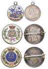 Victoria, young head shillings (2), brooch-mounted, reverses enamelled, the first dated 1871 central pink rose and wreath around, 1871 below; the seco...