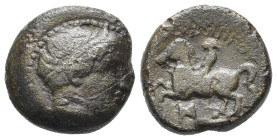 RE DI MACEDONIA. Filippo II (359-336 a.C.). AE (g 6,02). Testa diademata di Apollo a destra. R/ Cavaliere al galoppo a sinistra; monogramma sotto. HGC...