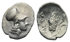 Lucania. Metapontion. Diobol. Circa 325-275 BC (Silver, 13.56 mm, 1.06 g). Helmeted head of Athena right. Rev. META, Ear of grain with leaf to right, ...