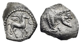 Sicily. Gela. Litra. Circa 465-450 BC (Silver, 11.35 mm, 0.55 g). Horse on loose bridle advancing right; above, wreath. Rev. [CEΛA], Forepart of man-h...