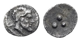Sicily. Himera. Tetras or Trionkion. Circa 460-450 BC (Silver, 7.05 mm, 0.14 g). Bearded male head right, with a goat's ear and horns. Rev. Three pell...
