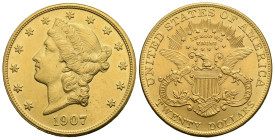 United States of America. 20 Dollars. Philadephia. 1907 (Gold, 34.34 mm, 33.58 g). Coroned Liberty head left; around, thirteen stars. Rev. Eagle with ...